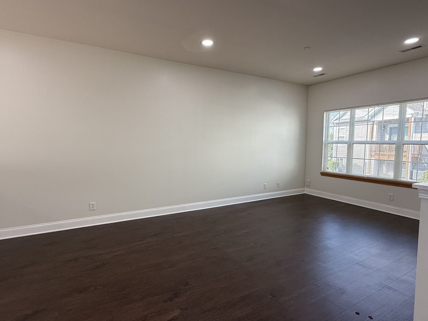 1392 Carolyn Court Yorkville, IL 60560 - Photo 10 of 23 an empty room with wooden floor and windows