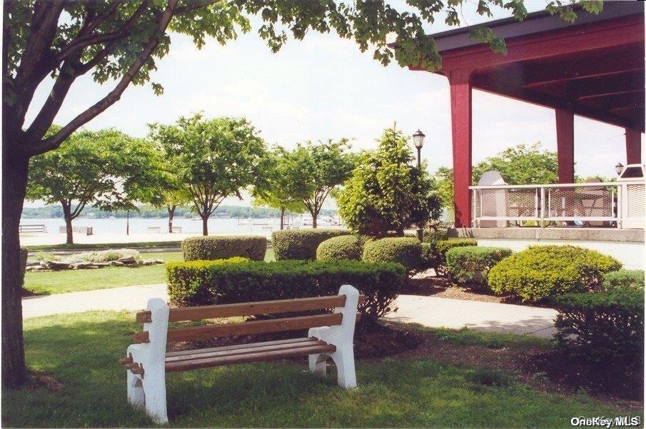 44 Graywood Road, Unit 2 Port Washington, NY 11050 - Photo 11 of 17 a view of a bench in the garden
