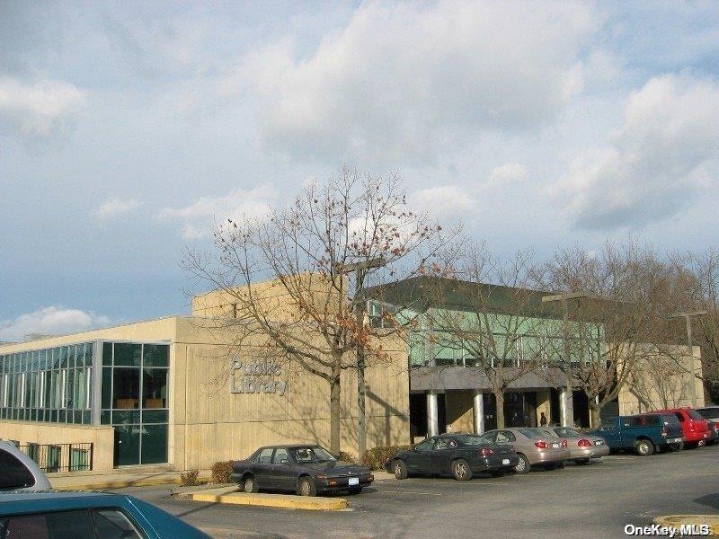 44 Graywood Road, Unit 2 Port Washington, NY 11050 - Photo 17 of 17 a front view of a building with parking