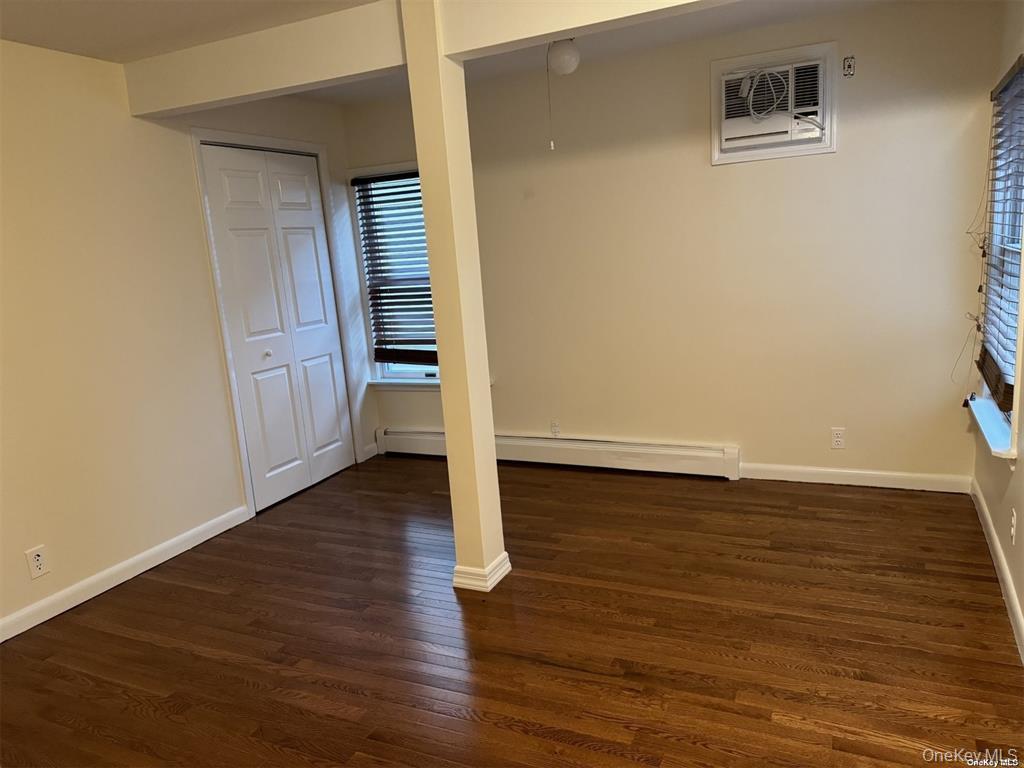 44 Graywood Road, Unit 2 Port Washington, NY 11050 - Photo 9 of 17 wooden floor in an empty room