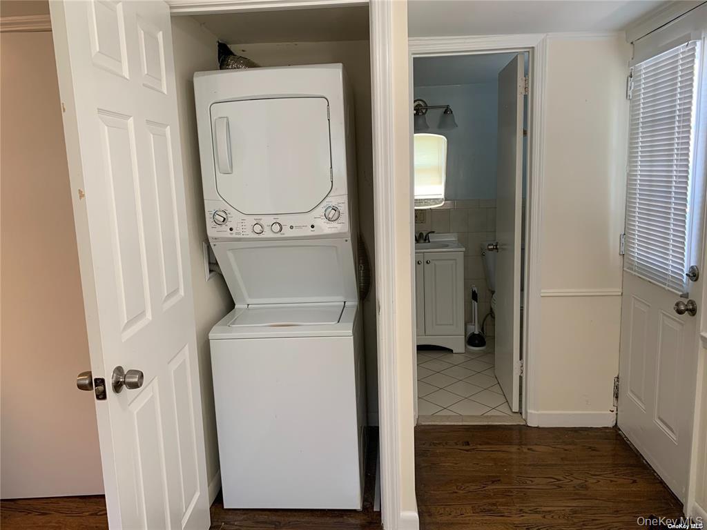 44 Graywood Road, Unit 2 Port Washington, NY 11050 - Photo 10 of 17 a view of hallway with washer and dryer
