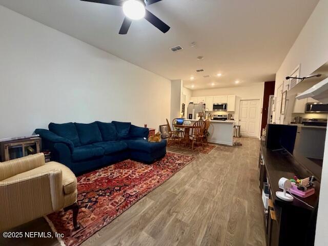 871 Rivertree Place Middleburg, FL 32068 - Photo 2 of 9 a living room with furniture kitchen view and a chandelier
