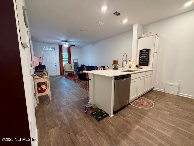 a kitchen with a sink a stove and cabinets