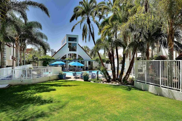 a view of a swimming pool and lounge chairs