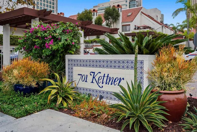 a view of balcony with furniture and front door