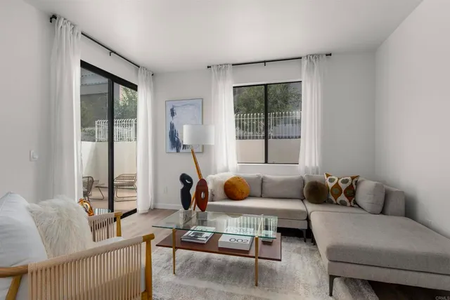 a living room with furniture and a window