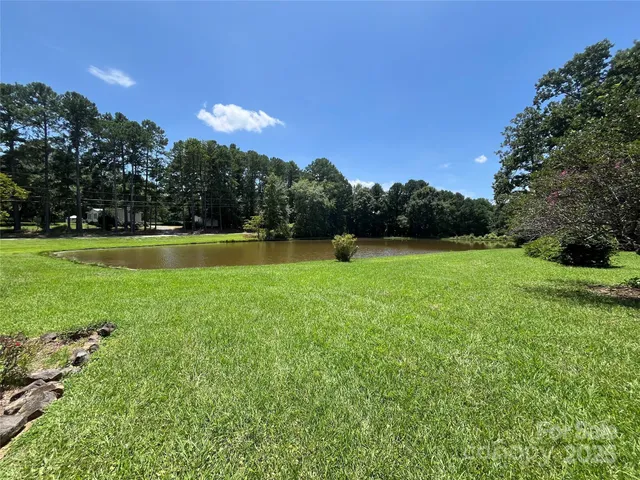 a view of a golf course with a lake