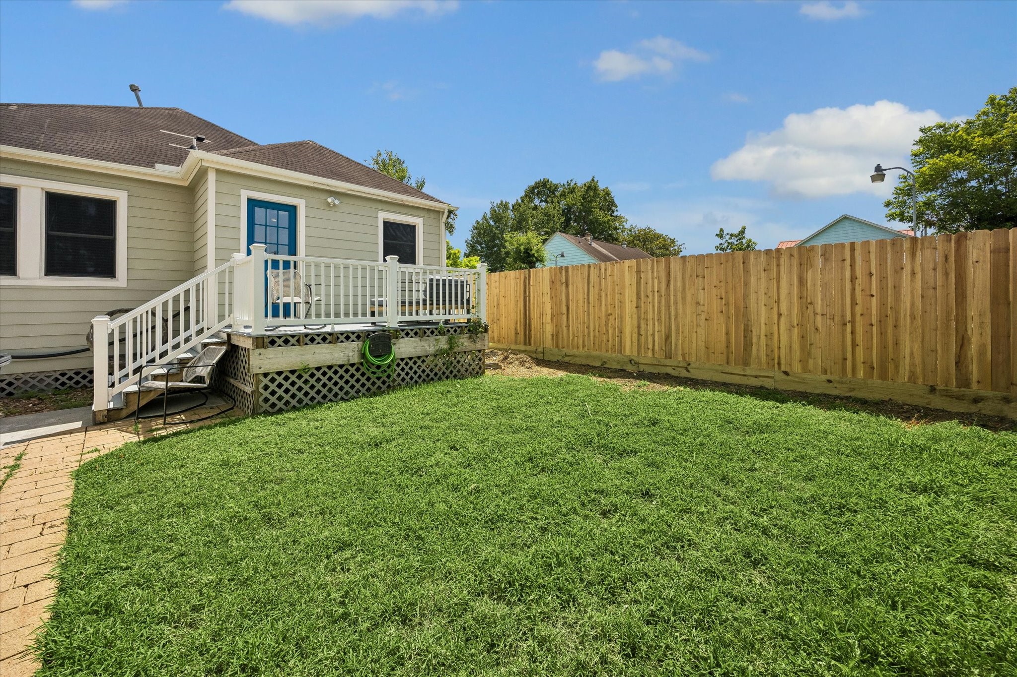 809 Gale Street Houston, TX 77009 - Photo 14 of 18 Generous fenced backyard with a sunny lawn and easy access to the back deck and garage.