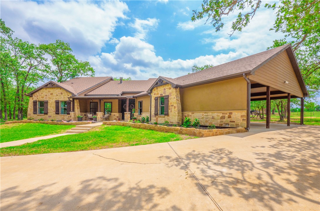 a front view of house with yard and green space