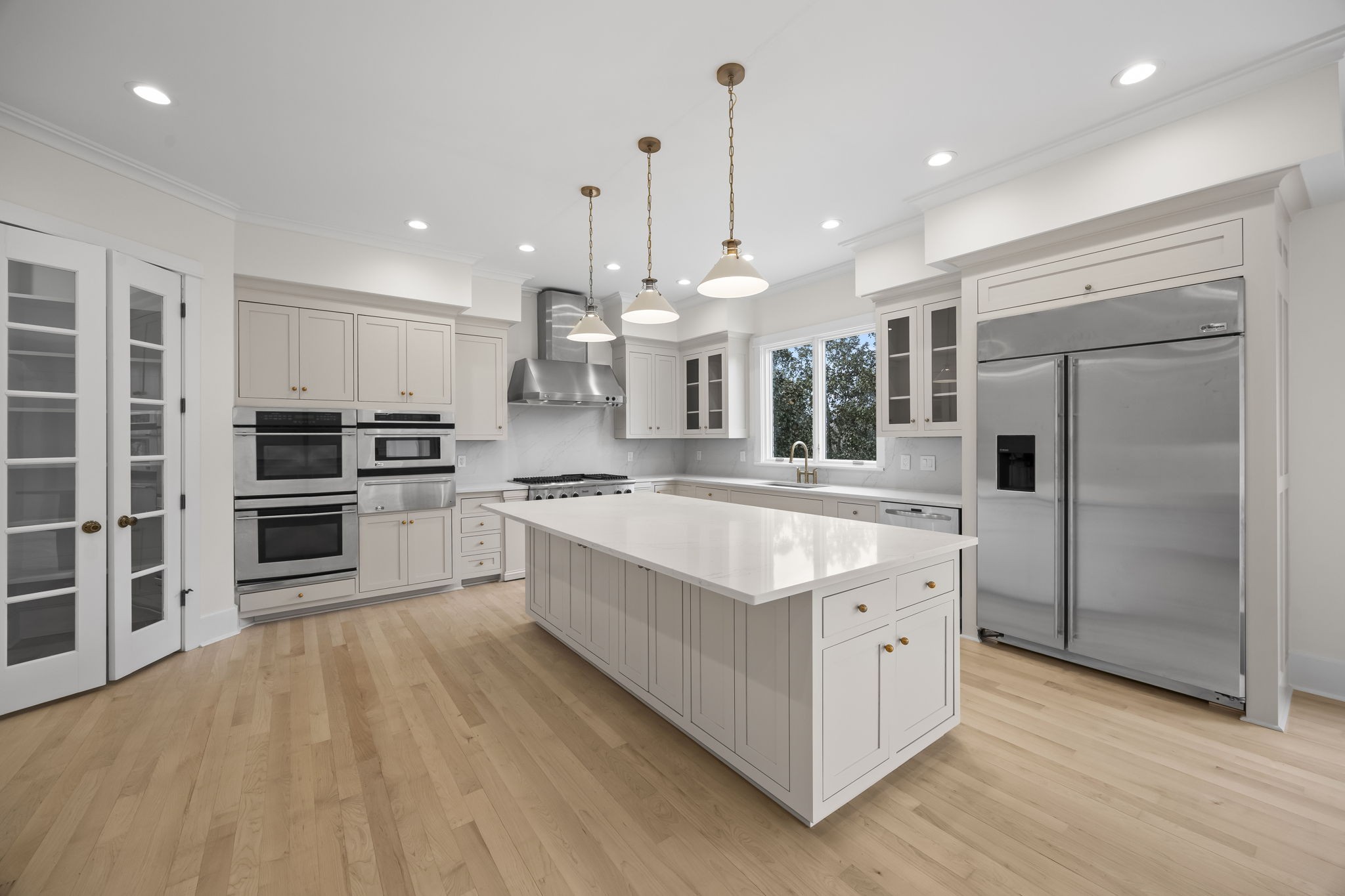 833 Highgrove Circle Franklin, TN 37069 - Photo 26 of 83 a large kitchen with stainless steel appliances and a large kitchen island
