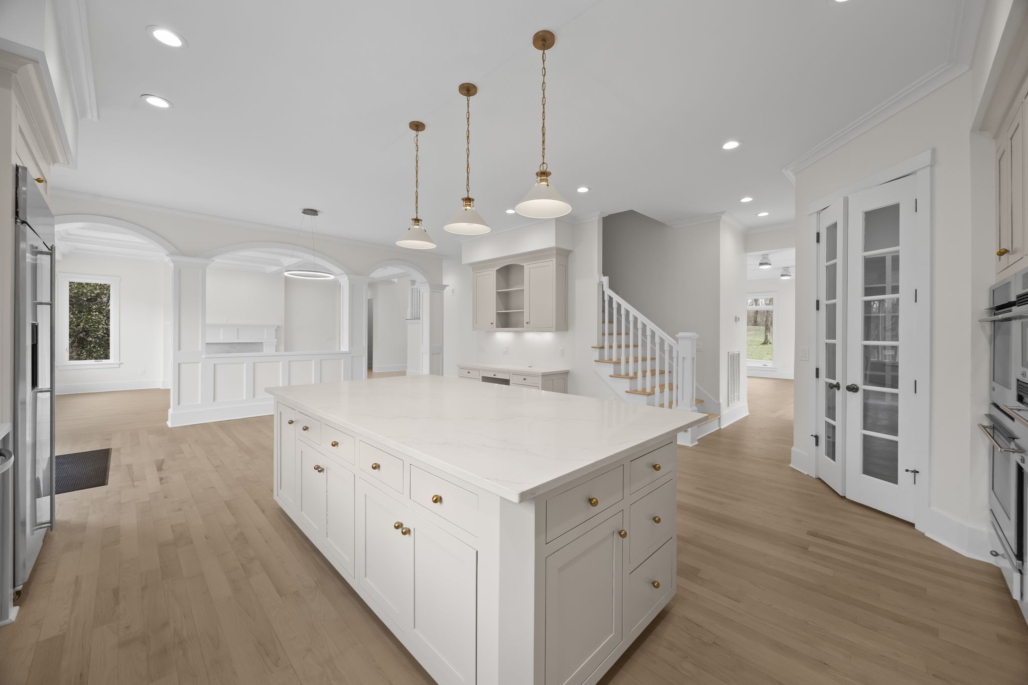 833 Highgrove Circle Franklin, TN 37069 - Photo 30 of 83 a large white kitchen with a large island oven a sink appliances and a large window