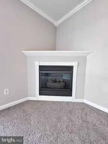 a view of a kitchen with a sink and a refrigerator