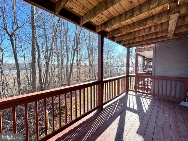 a view of a kitchen with furniture and windows