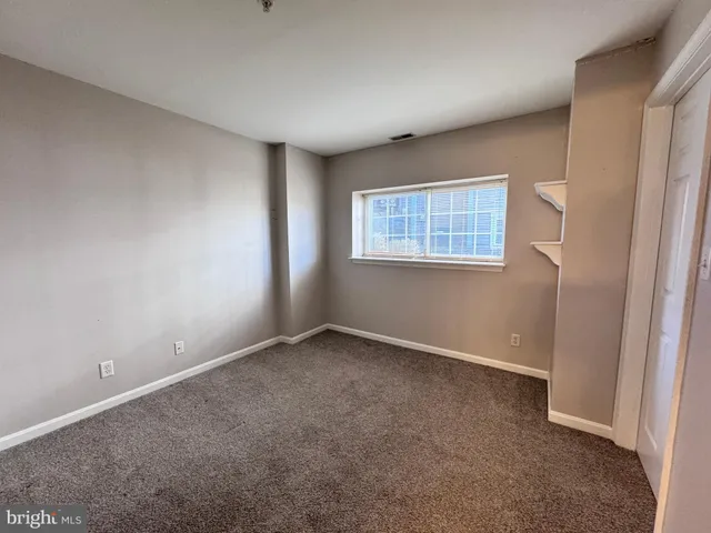 a bathroom with a sink a toilet a mirror and shower