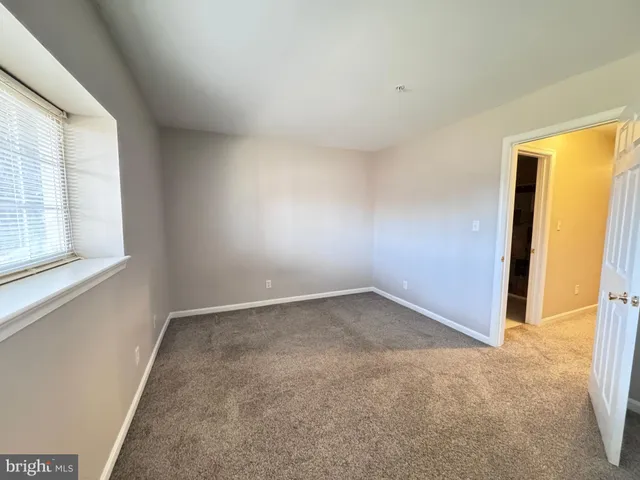 a bathroom with a sink toilet and mirror