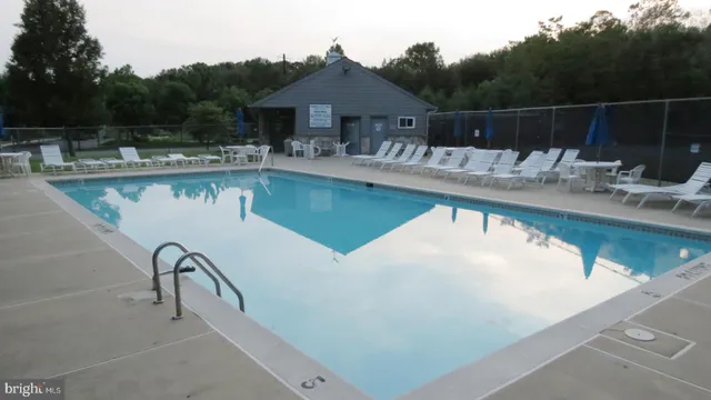 a view of a swimming pool with a patio