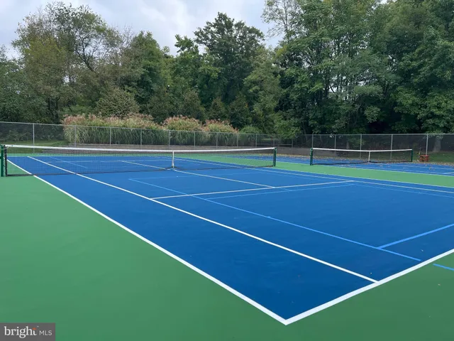 a view of an outdoor space and tennis court