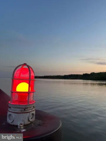 a view of a lake with chairs