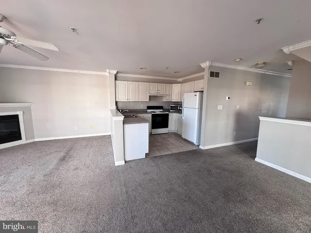 a view of a kitchen with window and stainless steel appliances