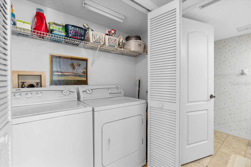 6501 Stone River Road, Unit 209 Bradenton, FL 34203 - Photo 14 of 45 a utility room with dryer and washer