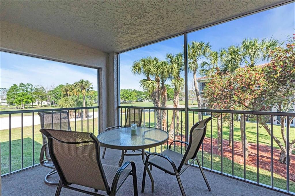 6501 Stone River Road, Unit 209 Bradenton, FL 34203 - Photo 3 of 45 a balcony view with a seating space and a ocean view