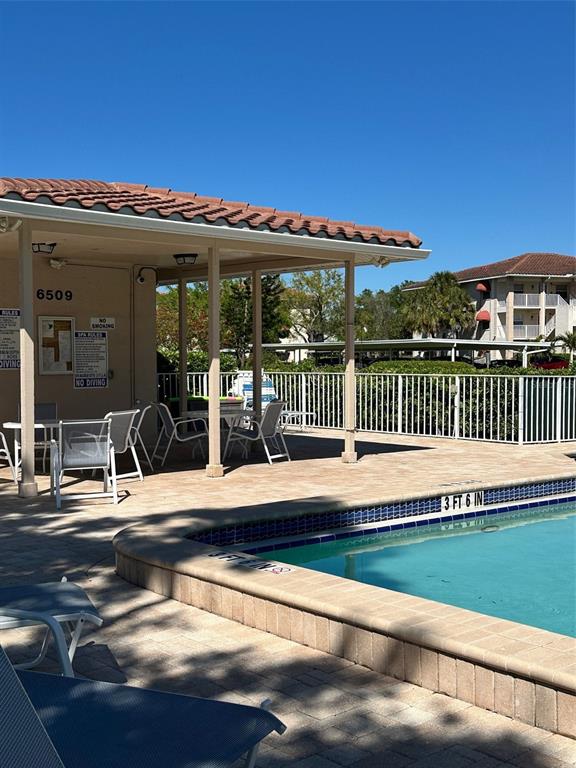 6501 Stone River Road, Unit 209 Bradenton, FL 34203 - Photo 42 of 45 a view of a swimming pool with a deck