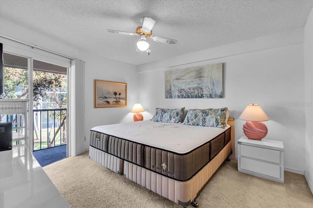 6501 Stone River Road, Unit 209 Bradenton, FL 34203 - Photo 7 of 45 a bed room with a bed and a chandelier