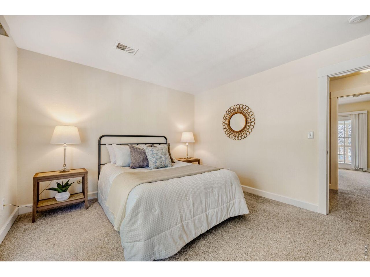 3515 Broadway, Unit B Boulder, CO 80304 - Photo 12 of 37 a bedroom with a bed and a lamp