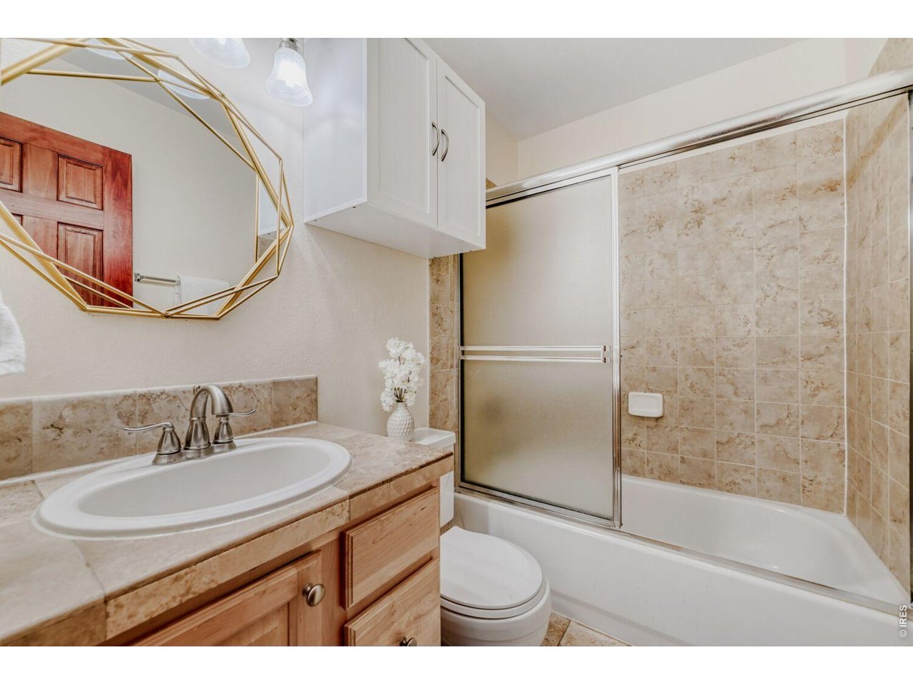 3515 Broadway, Unit B Boulder, CO 80304 - Photo 15 of 37 a bathroom with a sink and a mirror