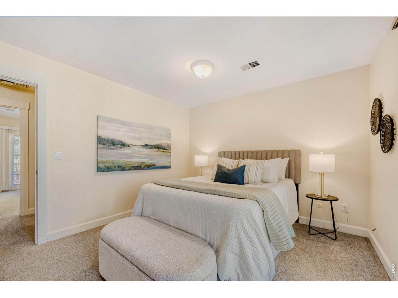 3515 Broadway, Unit B Boulder, CO 80304 - Photo 17 of 37 a bedroom with a bed and a painting on the wall
