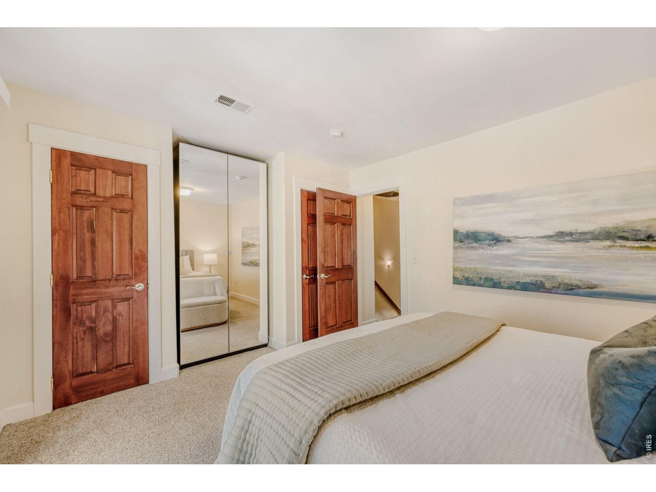 3515 Broadway, Unit B Boulder, CO 80304 - Photo 18 of 37 a bedroom with a bed and a painting on the wall