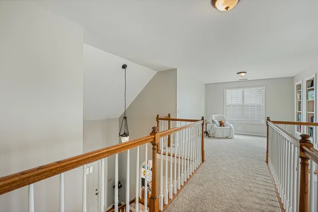 a view of a hallway with windows
