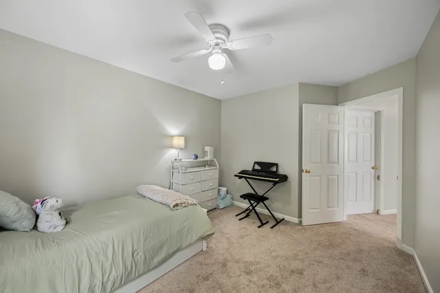 a bedroom with a bed and cabinets