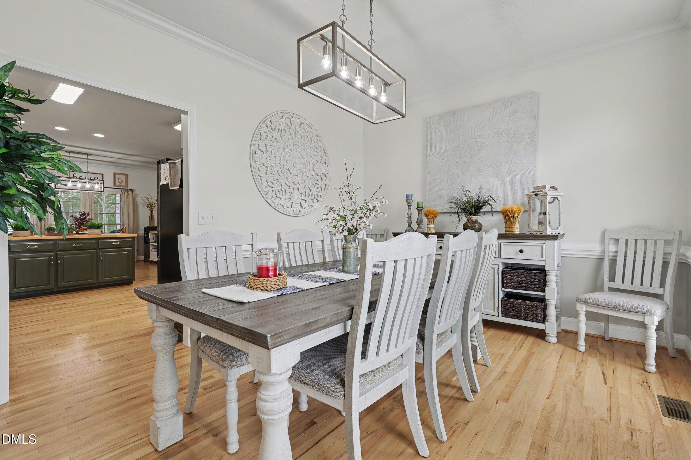 430 Fred Hall Road Stedman, NC 28391 - Photo 9 of 63 a view of a dining room with furniture and wooden floor