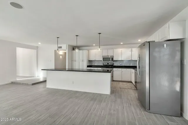 a view of a storage & utility room with wooden floor