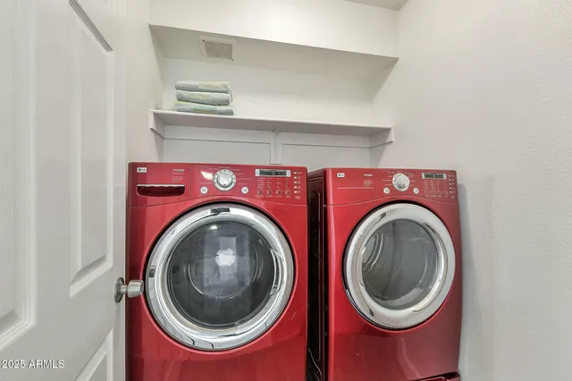 a view of an empty room and wooden floor
