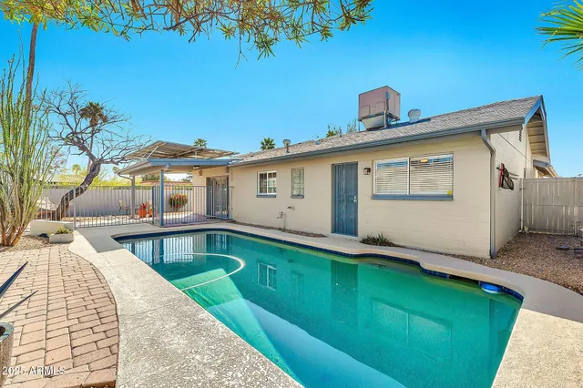 a view of a house with a swimming pool