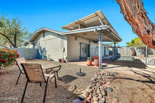 a view of a chairs and tables in the patio