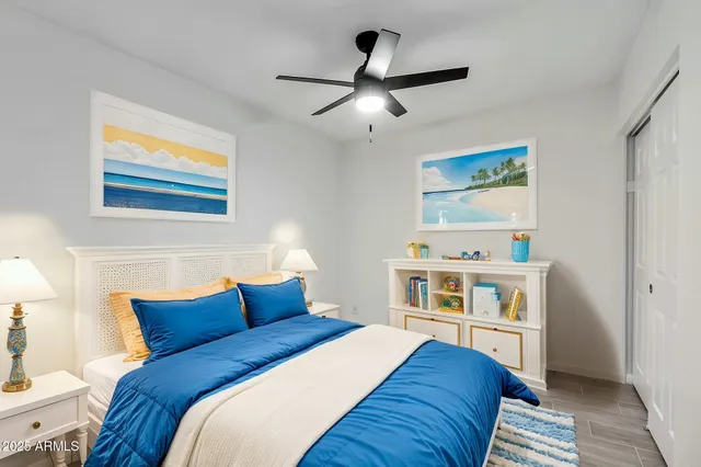 a bedroom with a bed and a view of kitchen