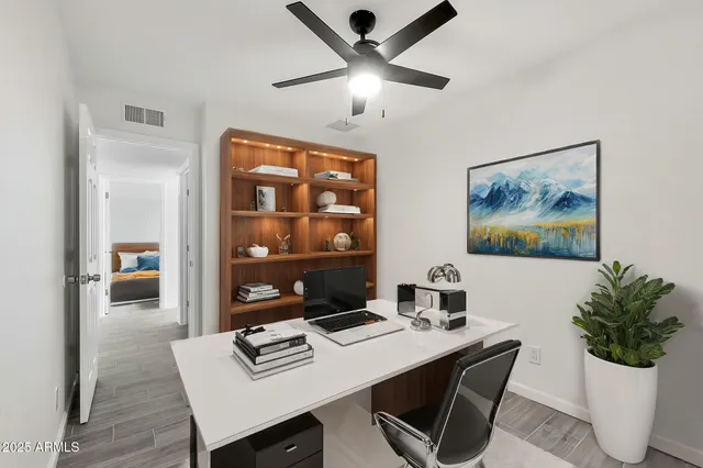 a workspace with furniture and window