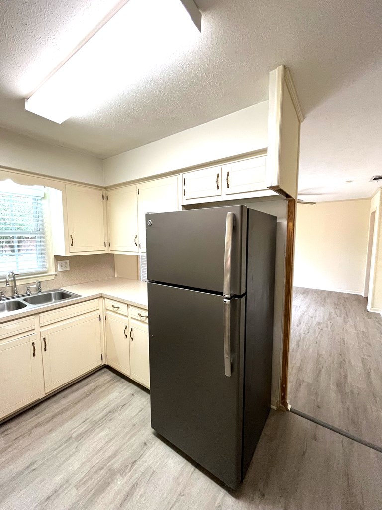 2113 Leeds Drive Columbus, GA 31904 - Photo 11 of 28 a kitchen with stainless steel appliances a refrigerator and a sink