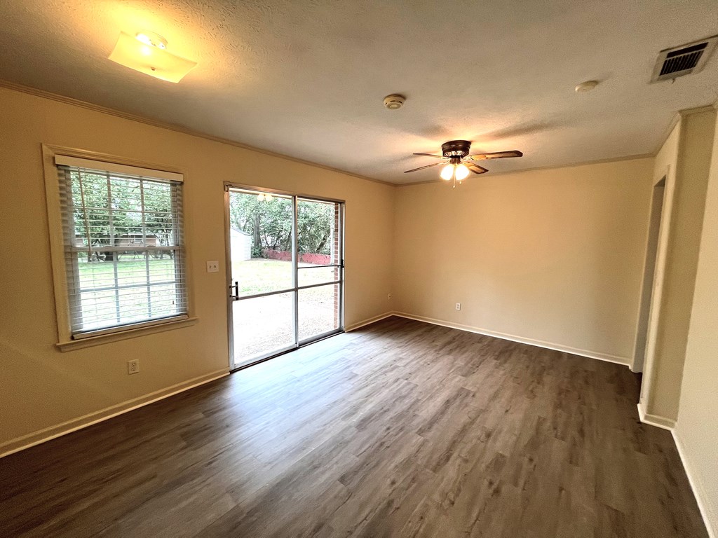 2113 Leeds Drive Columbus, GA 31904 - Photo 13 of 28 wooden floor in an empty room with a window