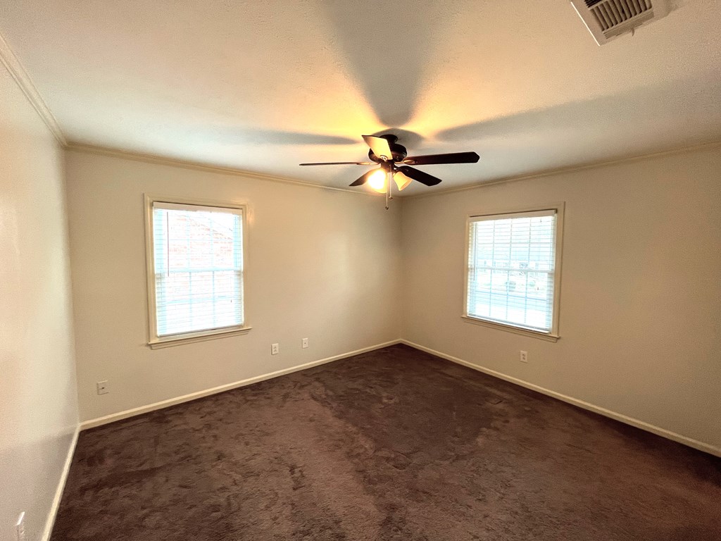 2113 Leeds Drive Columbus, GA 31904 - Photo 16 of 28 an empty room with a window and a fan