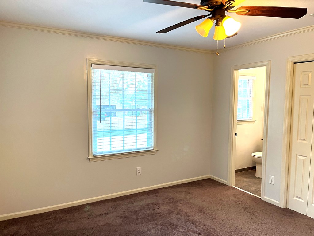 2113 Leeds Drive Columbus, GA 31904 - Photo 18 of 28 a view of an empty room with a window and wooden floor