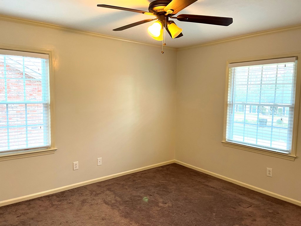 2113 Leeds Drive Columbus, GA 31904 - Photo 21 of 28 an empty room with windows and fan