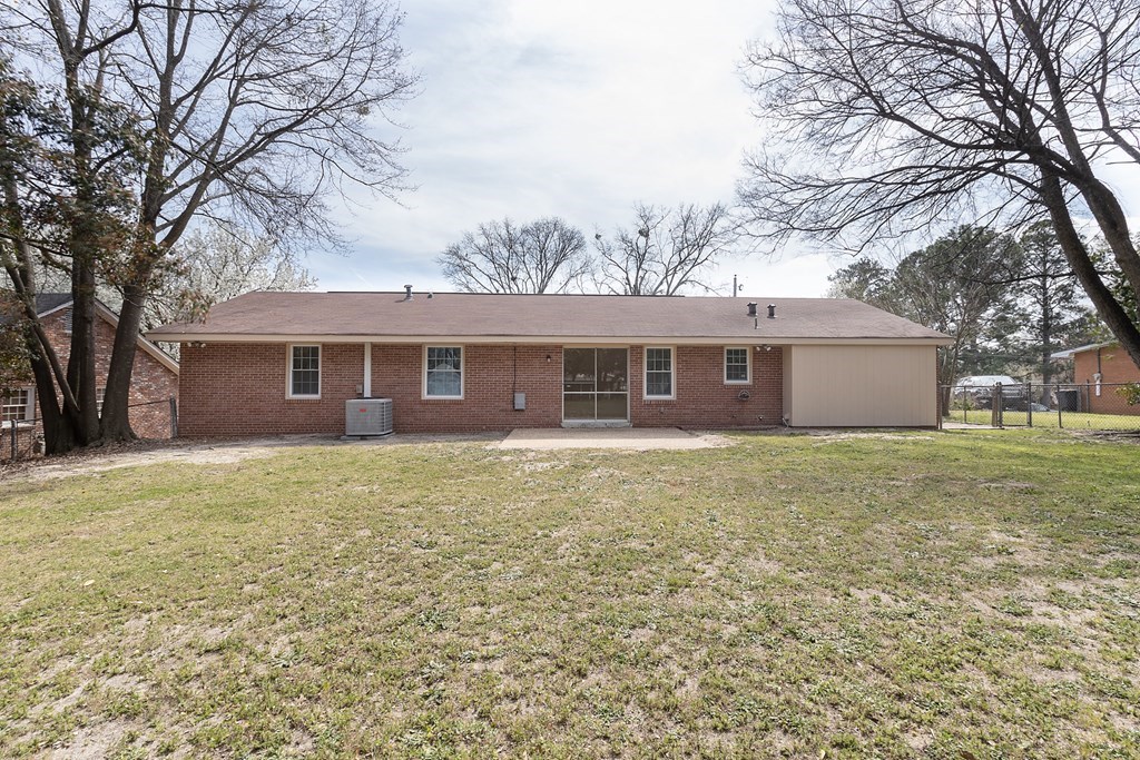 2113 Leeds Drive Columbus, GA 31904 - Photo 4 of 28 a view of a yard in front of a house with a large tree