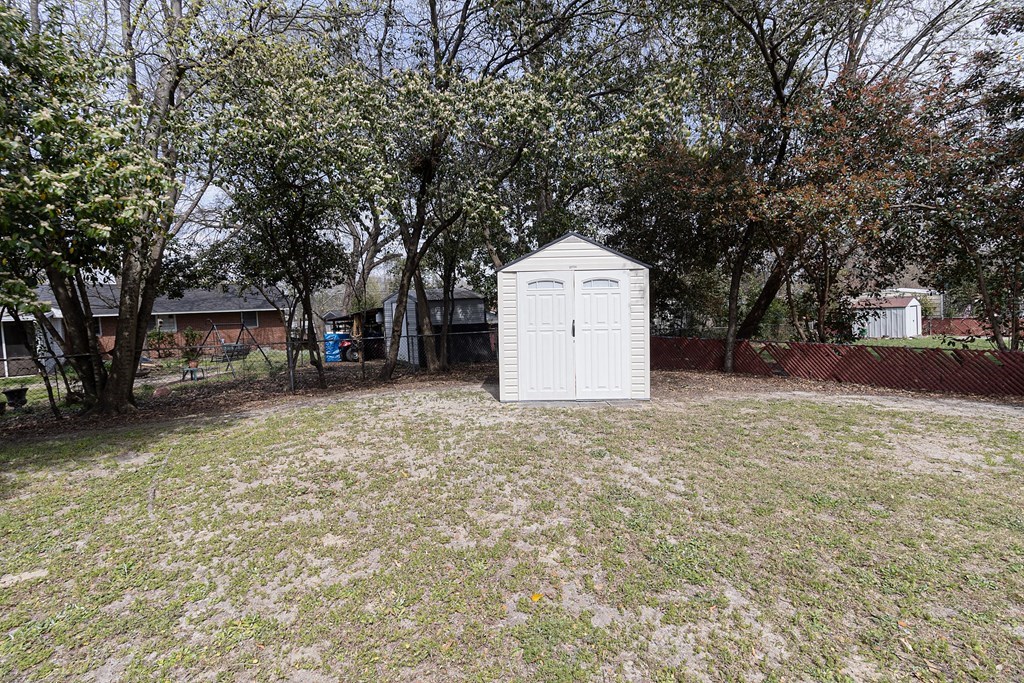 2113 Leeds Drive Columbus, GA 31904 - Photo 6 of 28 a view of a house with a yard and garage