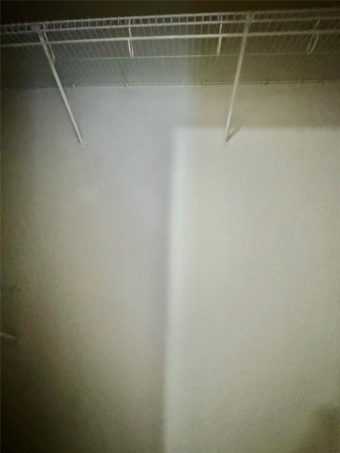 13600 Breton Ridge Street, Unit 36C Houston, TX 77070 - Photo 15 of 40 a view of a room with racks on the wall