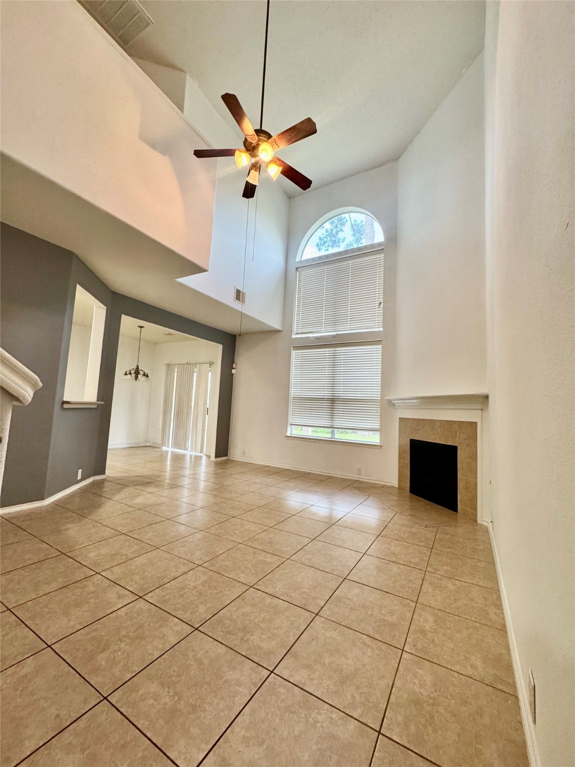 13600 Breton Ridge Street, Unit 36C Houston, TX 77070 - Photo 21 of 40 a view of an empty room with a fireplace and a window