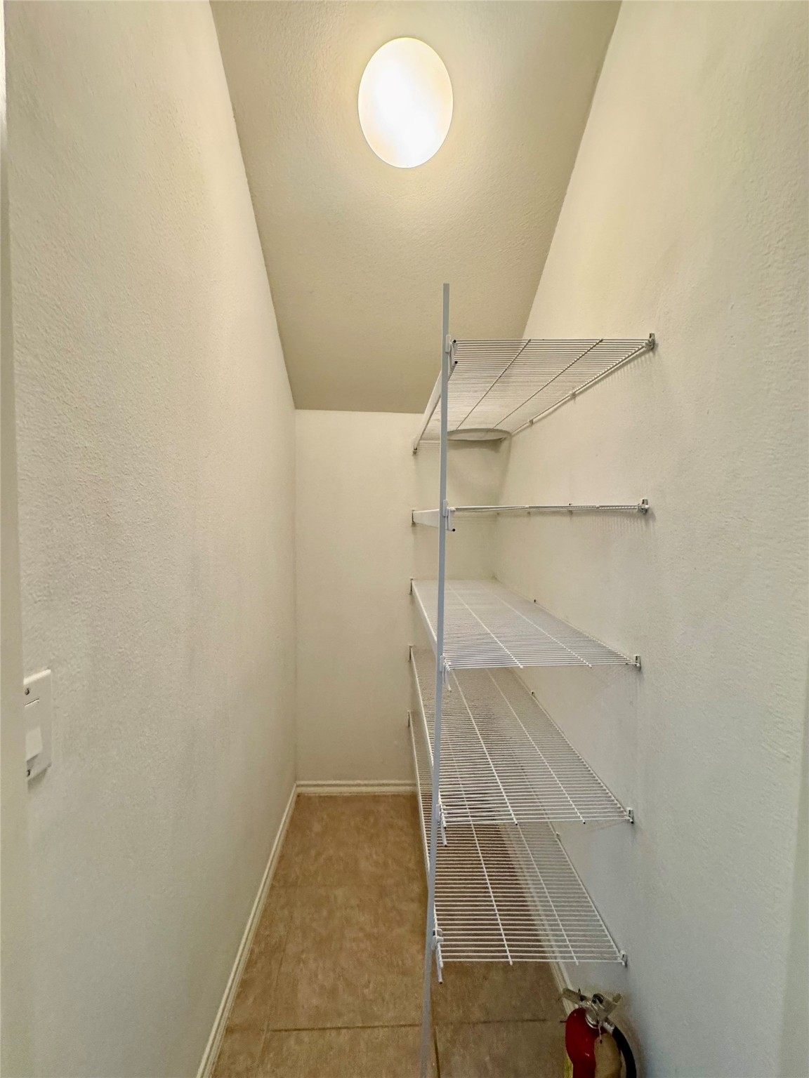 13600 Breton Ridge Street, Unit 36C Houston, TX 77070 - Photo 32 of 40 a view of walk in closet with empty racks